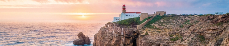 Coastal view with lighthouse in the distance in Lisbon, Portugal