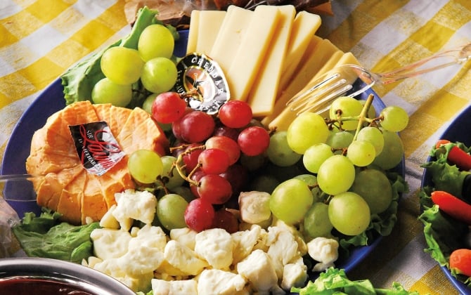 assorted foods set on a picnic table
