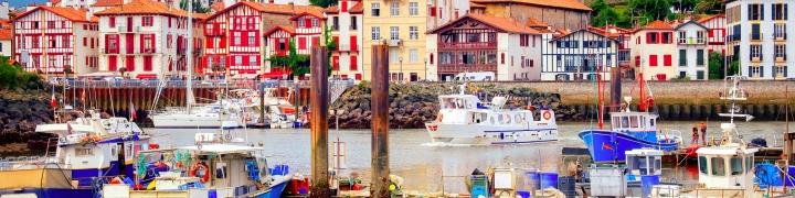View of traditional half-timbered basque houses in port of St. Jean de Luz, on the atlantic coast of France