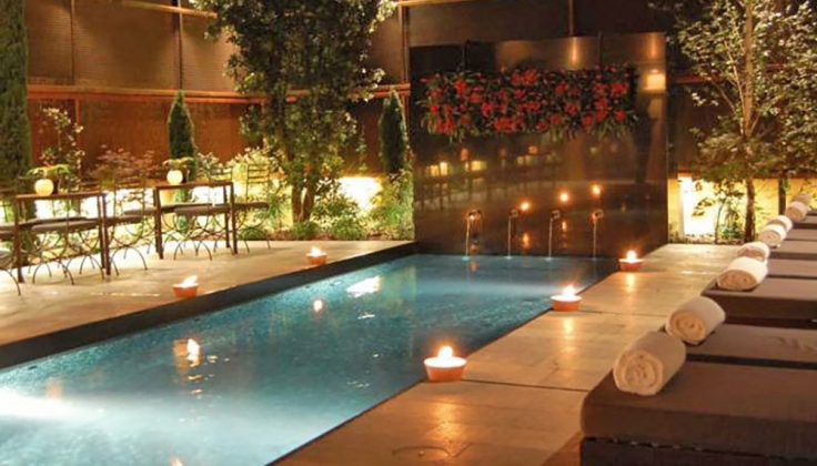 Hotel Nord pool surrounded by candles