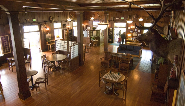 the hotel dining area with an elk head hung on the wall