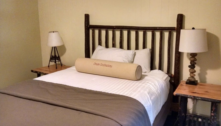a single bed with two nightstands