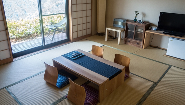 a table with 4 chairs legless chairs on tatami mats