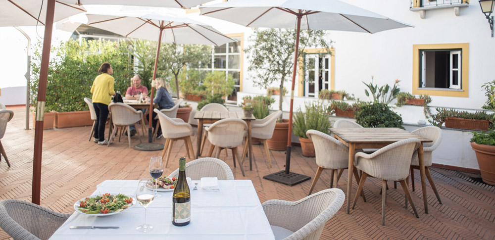 hotel exterior patio with dining tables