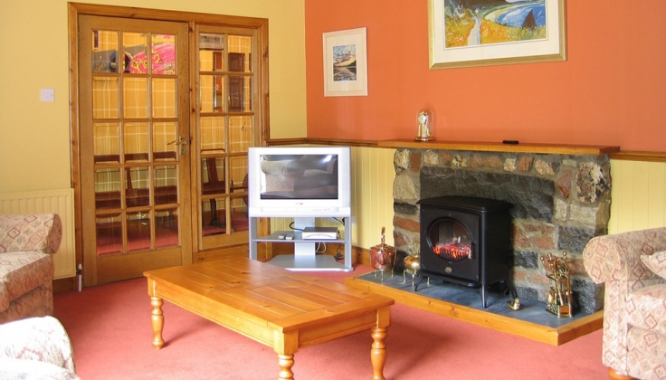 room with fireplace and chairs