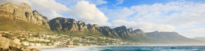 View to Camps Bay, a beautiful suburb of the city of Cape Town with white sandy beaches underneath the Table Mountain